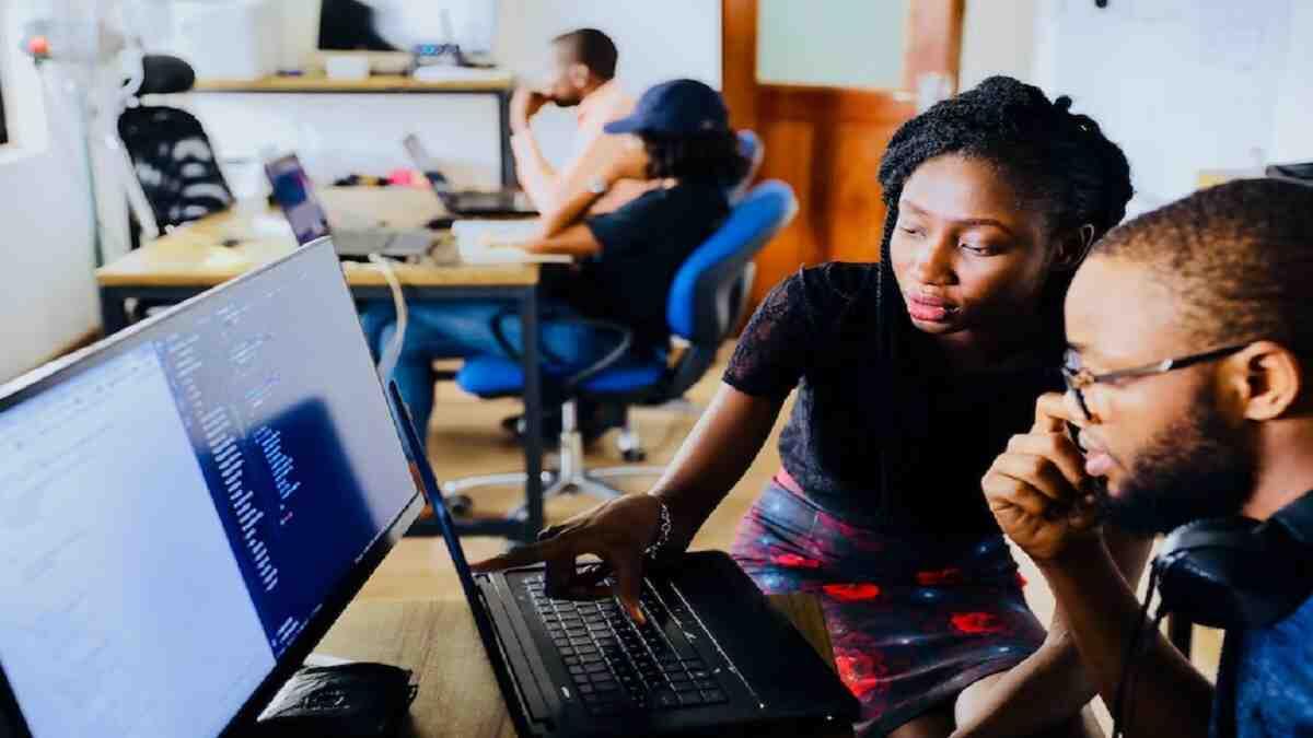 Interns working at a computer 