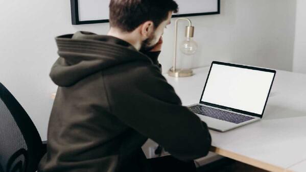 A student taking the NBT simulation test on a laptop